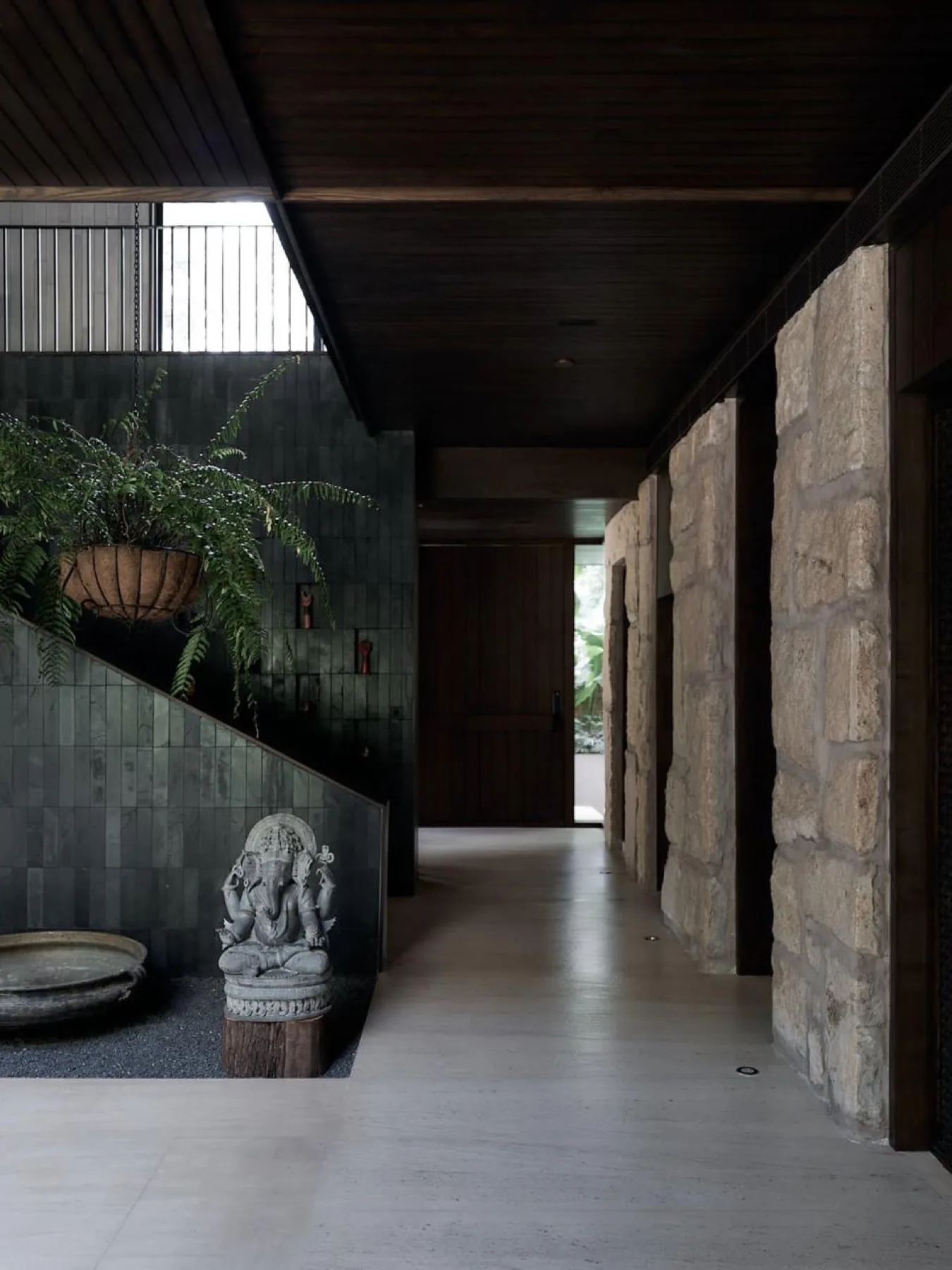 A stone corridor in a NUVÉ residence